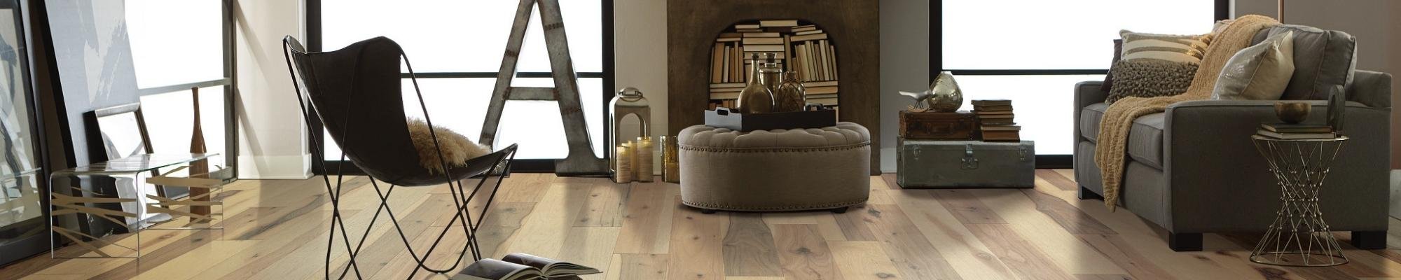 A living room with a table with books on it from Flooring Connection Outlet in San Antonio