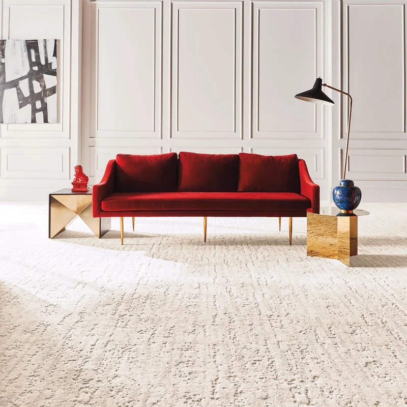 red sofa on white carpet by The Flooring Connection Outlet in San Antonio, TX