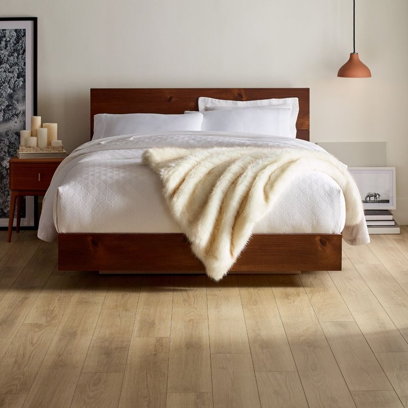 red bed with brown vinyl flooring by Flooring Connection Outlet in San Antonio, TX